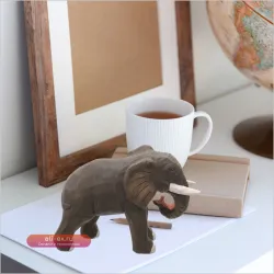 Резная скульптура слона из дерева: натуральный декор для рабочего стола и дома